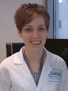 Dr. Melinda Yates in lab coat