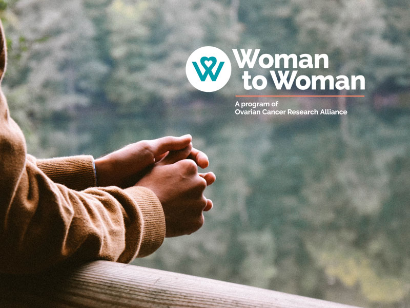 OCRA Woman to Woman logo, person looking out a window, only hands visible