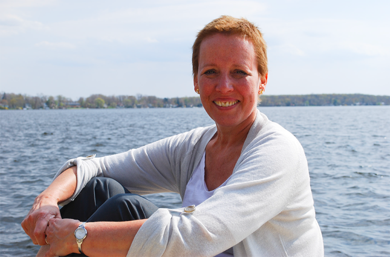 Jane Rubin smiling by lake