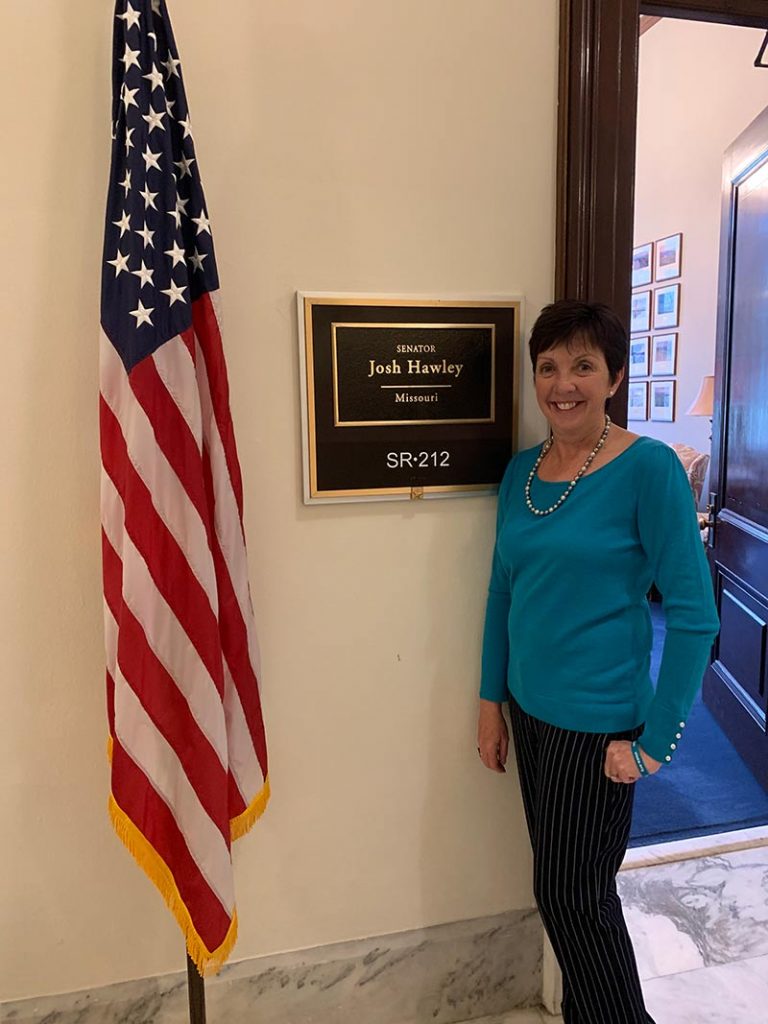 Sandy Sullivan in front of office of Senator Josh Hawley