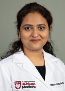 Photo: Dr. Sridevi Challa in professional headshot, wearing white lab coat