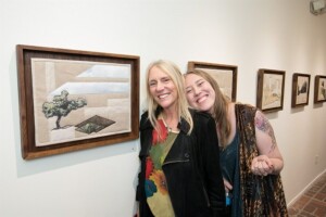 Pegi Young and Amber Young posing at art gallery