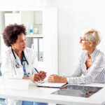 doctor and patient in doctor's office talking