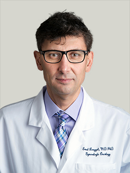 Dr. Ernst Lengyel wearing white lab coat