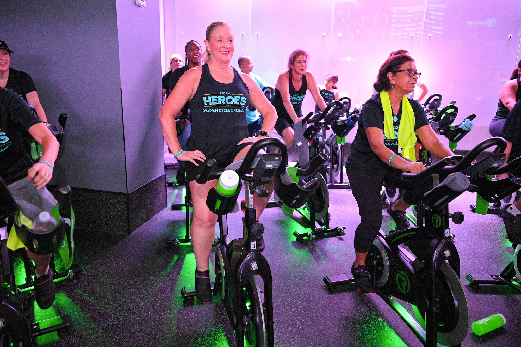 Participating ride indoor bikes at OCRA's Ovarian Cycle Orlando fundraising event
