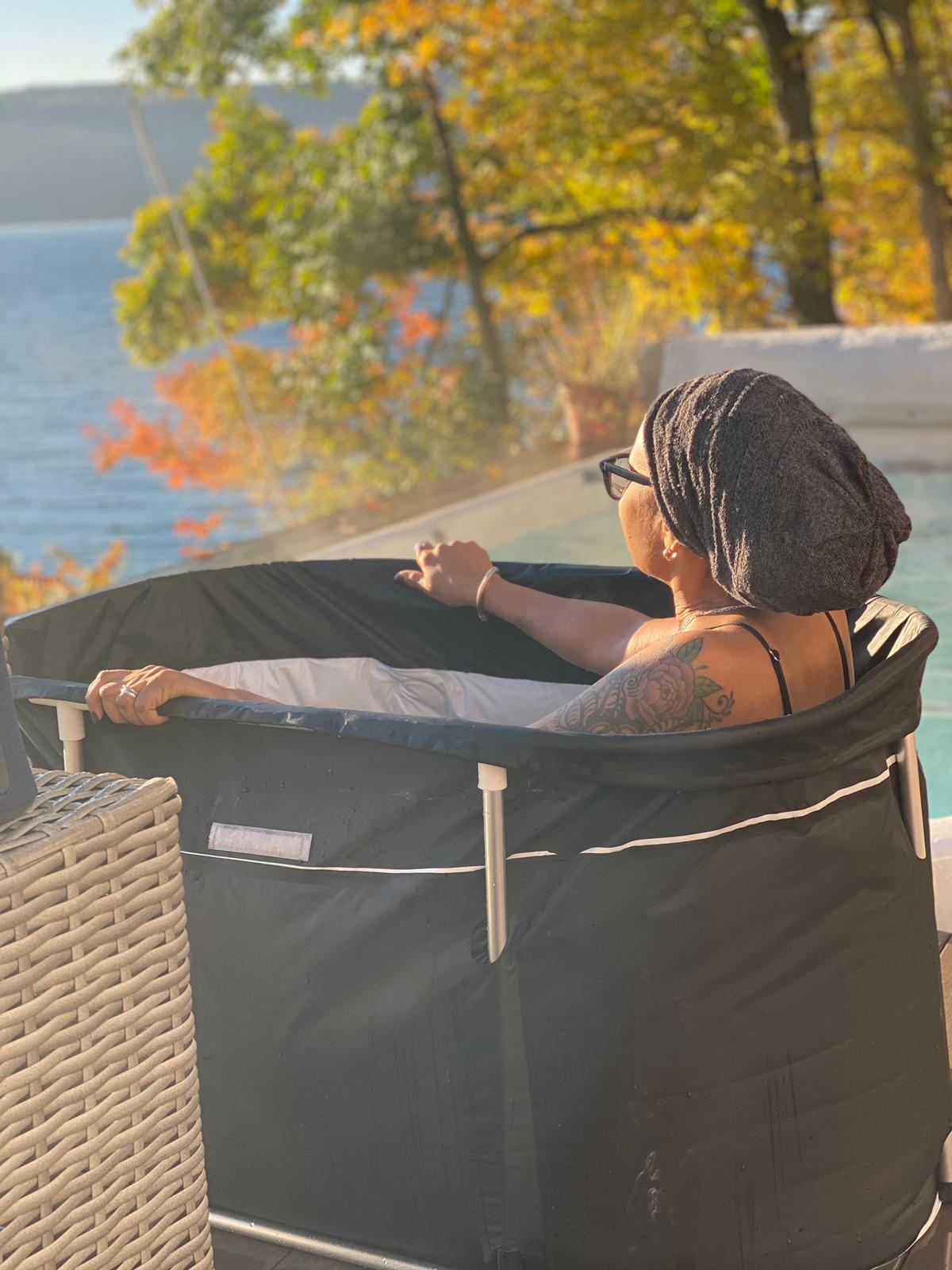 Woman wearing headwrap, looking out at the water