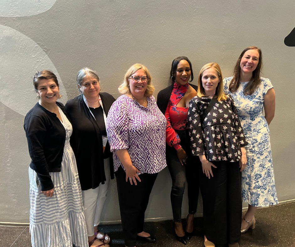 Members of Ovarian Cancer Research Alliance patient support team stand with staff from Iris by OncoHealth