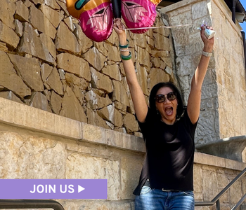 A joyful woman holds her arms up, with text overlay that reads Join Us