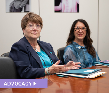 Two women in discussion with legislative representatives at OCRA's Spring Advocacy Day