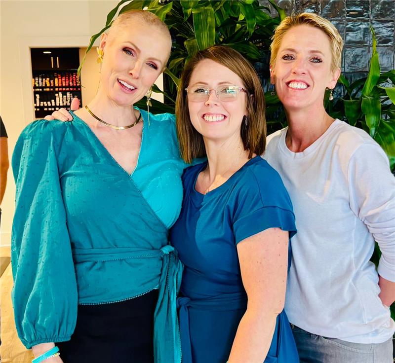 Three sisters stand together