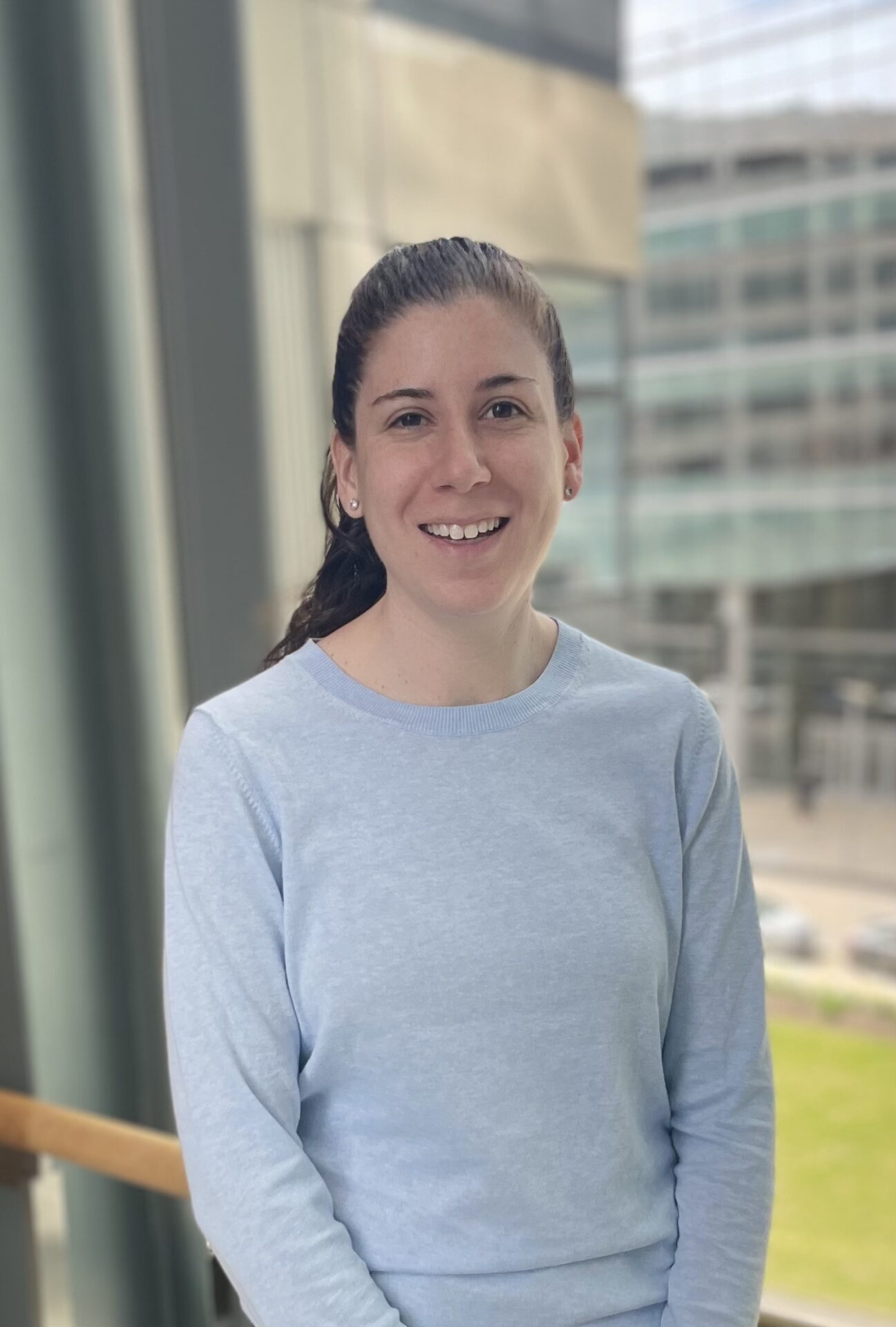 Michelle Swift, PhD, in front of window