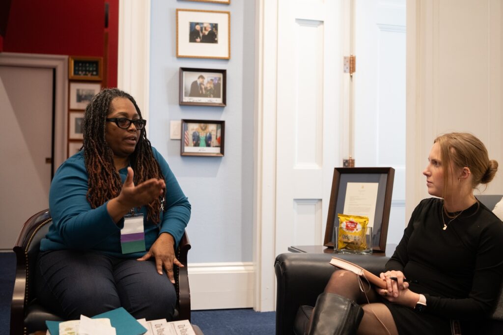 An OCRA Advocate Leader speaks with a Congressional representative.