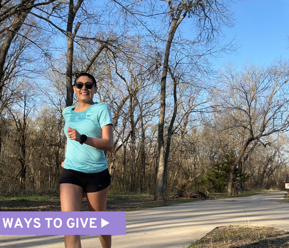 Ovarian cancer survivor wearing a teal t-shirt is jogging on the sidewalk in a wooded area, smiling at the camera and wearing sunglasses. Text reads, Ways to Give.