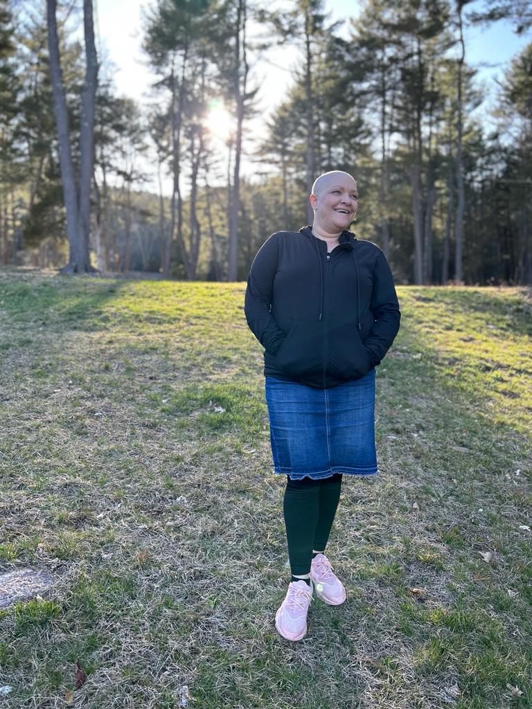 A cancer survivor walks through the park