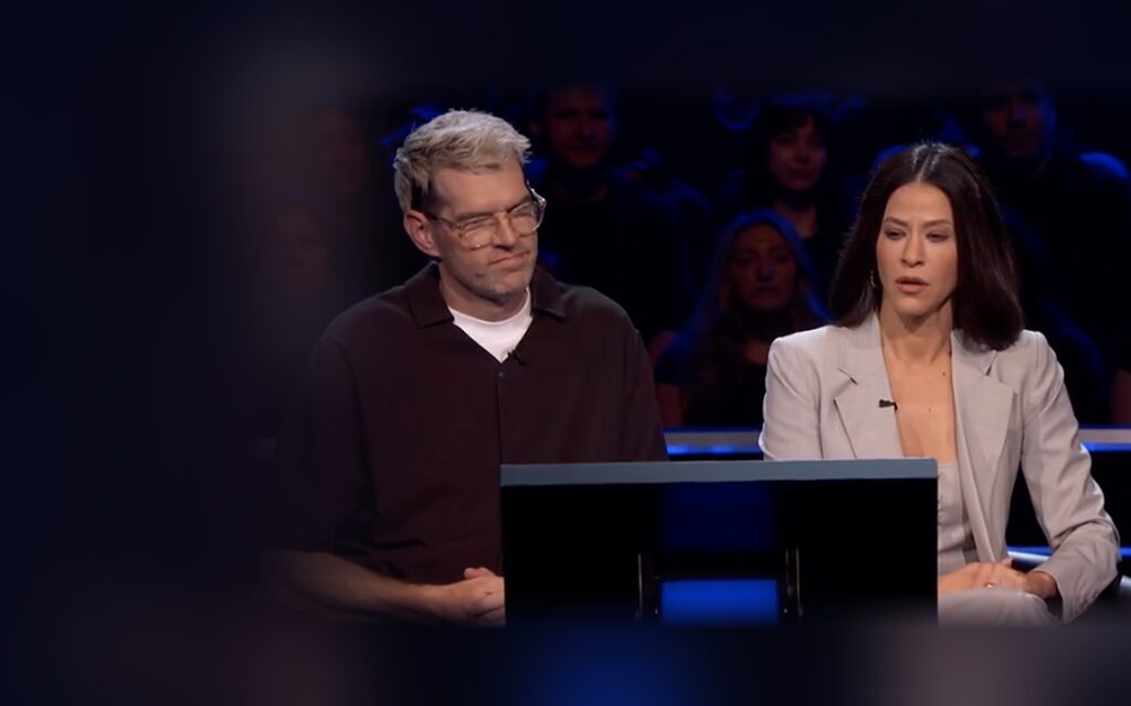Timothy Simons and Jackie Tohn playing Who Wants To Be A Millionaire
